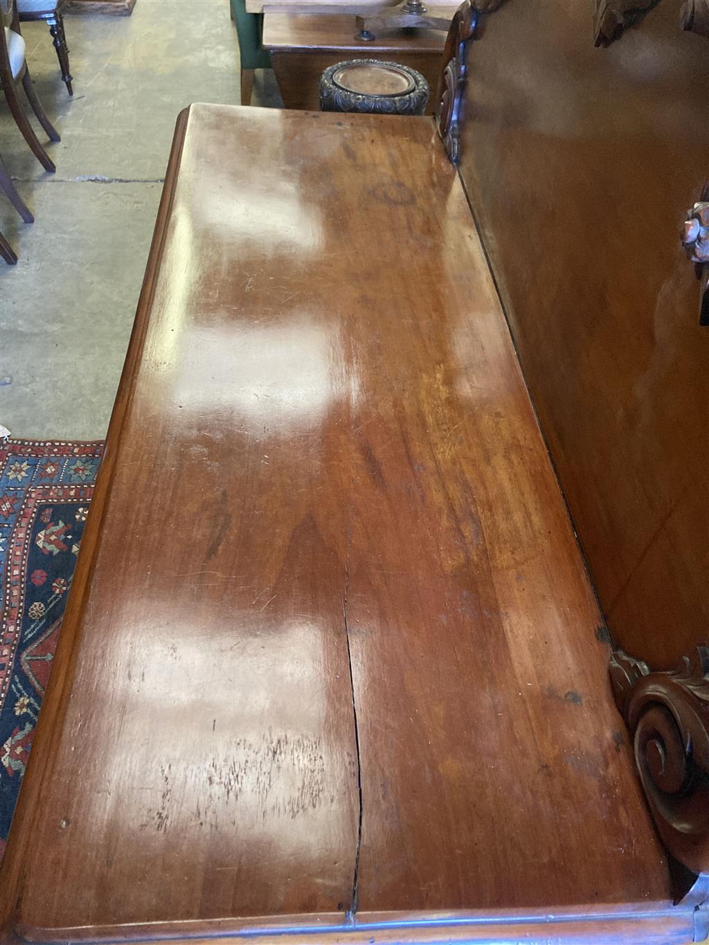 A Victorian carved mahogany sideboard fitted drawers and cupboard, length 150cm, depth 56cm, height 166cm